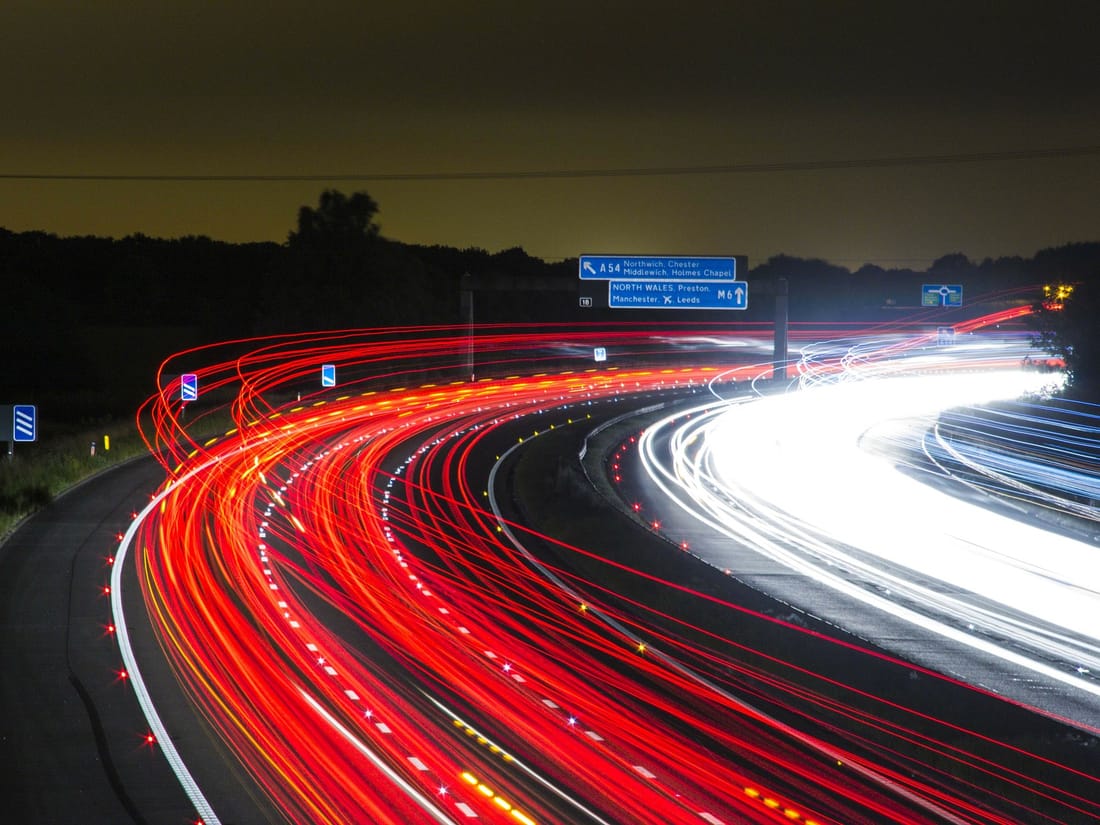 UK motorway at night with light trails