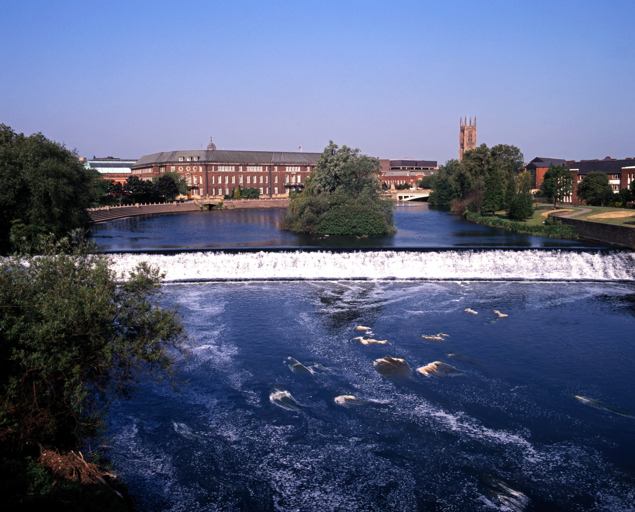 The River Derwent weir, with Derby Cathedral tower behind